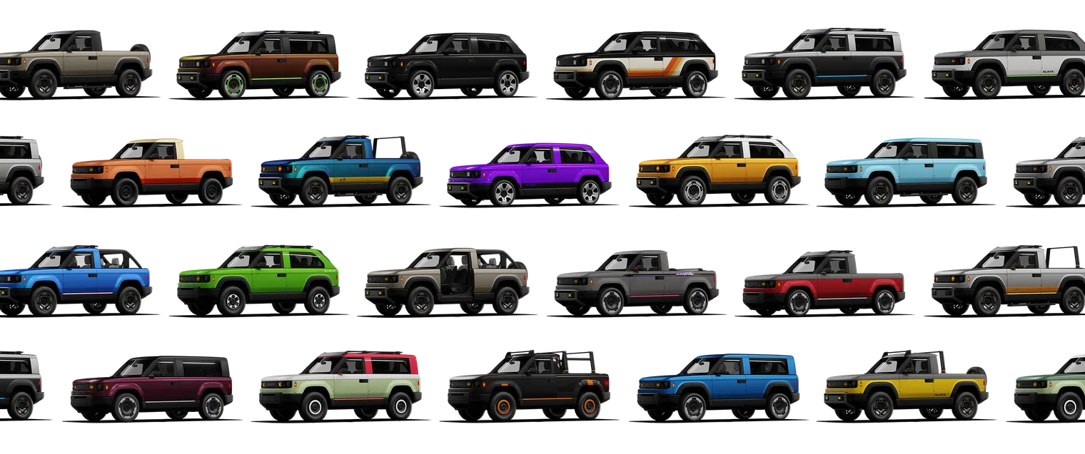 Une trentaine de Slate alignés en quatre rangées, pick-up et SUV, chacun dans un coloris différent : orange, bleu, violet, jaune, vert, noir, beige.